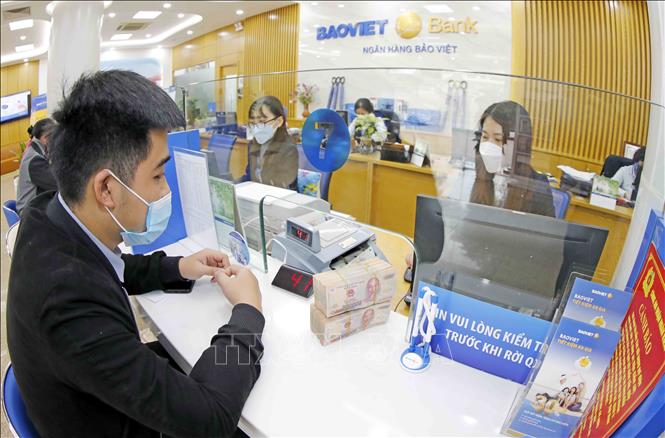 Triển vọng và thách thức ngành ngân hàng: Bài 1 - Ứng phó trước những cơn gió ngược Chú thích ảnh