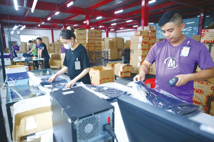 Lãi suất cho vay bình quân với khách hàng doanh nghiệp ở mức 6,5 - 6,75%/năm với khách hàng ưu tiên, 7 - 8%/năm với doanh nghiệp vay sản xuất, kinh doanh. Ảnh: Tiên Giang